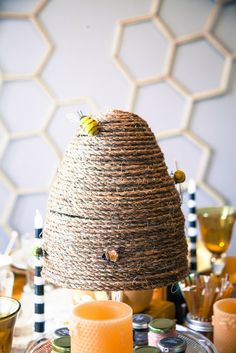 an image of a table setting with candles and honeycombs on the table top