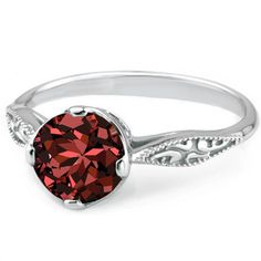 a ring with a red stone in the center