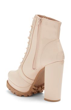 Instantly elevate any outfit with these platform booties featuring a dramatic block heel and lugged sole for trendy style. 4 5/8" heel, 1 1/4" platform 7" shaft height, 9 1/4" opening circumference Almond toe Lace-up vamp Side zip closure Covered block heel Lug platform sole PU upper/lining, plastic midsole, rubber outsole Imported Fall Combat Boots With Platform And Block Heel, Trendy Heeled Boots With Lug Sole And Block Heel, Chunky Platform Combat Boots With Block Heel For Fall, Fall Chunky Platform Block Heel Lace-up Boots, Fall Lace-up Boots With Chunky Platform And Block Heel, Fall Combat Boots With Chunky Platform And Block Heel, Chic Lug Sole Platform Boots For Fall, Trendy Ankle Heeled Boots With Lug Sole, Trendy Ankle Boots With Lug Sole