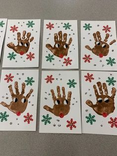 six handprints with snowflakes on them are arranged in the shape of santa's hands