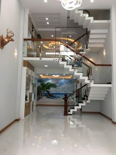 an open floor plan with stairs leading up to the second story