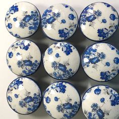 twelve blue and white porcelain knobs with flowers on them