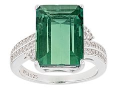 Pre-Owned 8.20ct emerald cut teal fluorite with .28ctw round white zircon, rhodium over sterling silver bypass ring. Measures approximately .84"L x .59"W. Not sizeable..  This product may be a customer return, vendor sample, or on-air display and is not in its originally manufactured condition.  It may not be new.  In some instances, these items are repackaged by JTV. Modern Green Jewelry With Accent Stones, Modern Emerald Jewelry With Accent Stones, Modern Emerald Jewelry With Center Stone, Elegant Green Topaz Ring In Sterling Silver, Emerald Cut Green Gemstones With Accent Stones, Elegant Emerald Cut Gemstones With Accent Stones, Green Emerald-cut Gemstone Accent Jewelry, Green Emerald Cut Jewelry With Gemstone Accents, Emerald Cut Green Gemstone Jewelry