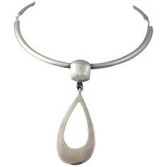 Mid 20th century choker necklace with a large open teardrop pendant by Joachim S'Paliu, the entire piece has his usual modernistic flair. I would say the necklace portion has an inside circumference of approximately 14" , the pendant is about 3.37" long. The piece is marked on the hook clasp sterling and S'Paliu and on the back of the pendant Spain. Artist information: Designer Joachim S’Paliu of Spain is a wonderful example of modernist style from the 70's. Born in 1944, the designer was at his Contemporary Silver Drop Jewelry, Contemporary Teardrop Silver Jewelry, Contemporary Teardrop Metal Jewelry, Contemporary Drop Jewelry For Formal Occasions, Contemporary Formal Drop Jewelry, Formal Drop Contemporary Jewelry, Modern Teardrop Pendant Necklaces, Modern Teardrop Pendant Necklace With Polished Finish, Modern Teardrop Pendant Necklace With Large Pendant