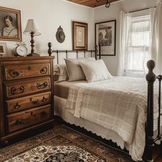 a bed sitting next to a window in a bedroom