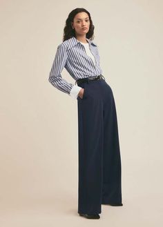 The fiona pant is a flat-front trouser. with a high waist and fluid wide-leg silhouette these relaxed-fit trousers are cut from a structured suiting blend fabric with a comfortable stretch that's suitable for all four seasons.    - 63% polyester 32% rayon 5% elastane  - lameka is 5'9.5" wearing size 2  - inseam: 33"  - rise: 11.75" Navy Trousers Outfit, Capsule Wardrobe Outfits, Trouser Outfit, Favorite Daughter, Fitted Trousers, Four Seasons, Capsule Wardrobe, Dress Pants, Long Dress