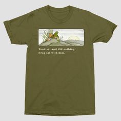 Style casually and stay comfy with the Men's Frog and Toad Short Sleeve Graphic T-Shirt in Moss Green. Made from a midweight blend of cotton and polyester, this short-sleeve tee has a classic crewneck for keeping you relaxed. The standard fit ensures ease of movement, making it a cool addition to your daily wardrobe. Frog And Toad Shirt, Frog And Toad Outfit, Nature Clothes, Funny Clothing, Cozy Clothes, Oc Board, Dream Summer, Fall Mood, Gift Inspo