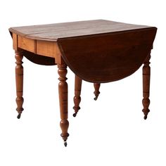 an old wooden table with two legs and a small drawer on the top, against a white background