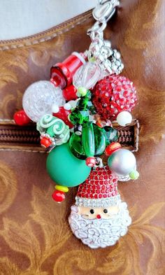 a christmas ornament hanging from the side of a purse