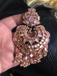 Very stylish high quality kundan long earrings with baby pink color on kundan and beads. Size : 4 1/2 inch length and 3 inch width Made to order and shipping time 4-6 weeks. Elegant Pink Stone Work Danglers, Elegant Pink Danglers With Stone Work, Elegant Pink Kundan Tikka, Pink Elegant Kundan Tikka, Elegant Pink Tikka For Festivals, Pink Chandbali Tikka As Gift, Temple Jewelry Chandbalis With Mirror Work As Gift, Pink Kundan Dangle Jewelry, Pink Kundan Chandelier Earrings