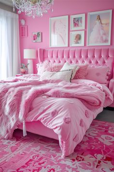 a pink bedroom with pictures on the wall