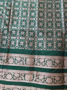 This Banarasi handloom pure silk lehenga is a perfect festive/wedding/occasional wear it enhanced with green color motifs.  Occasion: party wear/wedding  Materials. Pure silk. Unstich  Fabric design - Banarasi  lehenga  Pattern: paisley/buti motifs.  Borders: yes  Border type: Zari  Zari type: golden zari. Fabric length with blouse and with dupatta.  Borders is 6.5 meters  Blouse: 0.85 Meters  No of kali: 18 Size of kali 42 inch  No of border in dupatta 9 Traditional Green Raw Silk Sharara, Green Tussar Silk Set With Dupatta, Festive Green Tussar Silk Sharara, Green Raw Silk Anarkali Set For Festivals, Green Tussar Silk Sharara With Traditional Drape, Green Raw Silk Sharara For Festivals, Green Tussar Silk Bollywood Sharara, Festival Green Raw Silk Anarkali Set, Bollywood Style Green Tussar Silk Sharara