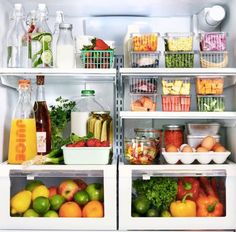 an open refrigerator with food in it and drinks on the shelves next to each other