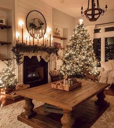 a living room filled with furniture and a christmas tree in front of a fire place