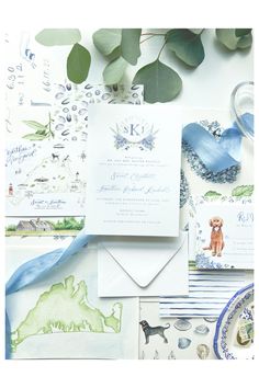 the wedding stationery is laid out on top of each other