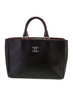 Chanel ToteBlack LeatherInterlocking CC Logo & Quilted PatternAntiqued Silver-Tone HardwareRolled HandlesGrosgrain Lining & Dual Interior PocketsSnap Closure at TopProtective Feet at BaseIncludes Dust BagUnfortunately, due to restrictions, this item may not be eligible for shipping in all areas. Chanel Neo Executive Tote, Handbag Handles, Saint Laurent Bag, Work Bags, Cc Logo, Bag Handle, Shirt Accessories, Christian Louboutin Shoes, Sweater Accessories