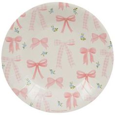 a paper plate with pink bows on it