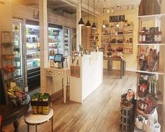 the inside of a grocery store with lots of shelves