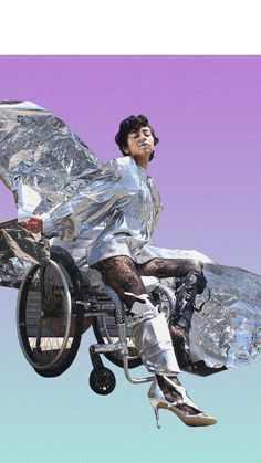 a man riding on the back of a bike covered in tin foil and flying through the air