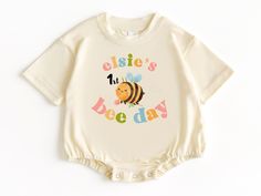 Bee Birthday T Shirt Bubble Romper, First Birthday Outfit, Baby Bodysuit, First Birthday Shirt, Bee Birthday, Birthday Girl Shirt 💗  Welcome to The WildflowerbyMiley Etsy Shop!  This listing is for the bodysuit, sweatshirt or t-shirt only. All other items that are shown in our photos such as shoes, hats, beanies, blankets etc. are for photo staging purposes and are NOT INCLUDED in the sale. DESCRIPTION:  This baby and children's unisex essential fits like a well-loved favorite. Super soft t-shi First Birthday Shirt, First Birthday Outfit, First Birthday Shirts, Birthday Girl Shirt, First Birthday Outfits, Bubble Romper, Girl Shirt, Gender Neutral Baby