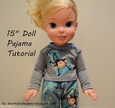 a doll with blonde hair and blue eyes wearing pajamas