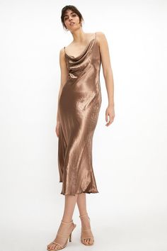 Bring '90s cool to your next event with this slinky satin dress. Cut to flatter with its cowl neck, fitted shape and midi length, the dress also features adjustable shoulder straps to give you that perfect fit. Keep it minimal on the styling with classic hoops and slingback sandals.Style: Slip DressFabric: SatinLength: MidiNeckline: CowlSleeve Length: Sleeveless Graduation Dresses 2022, Ball Inspiration, Cowl Neck Midi Dress, Green Slip Dress, Trendy Party Dresses, Cowl Dress, Best Prom Dresses, Prom Outfits, Slingback Sandals