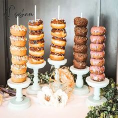 there are many donuts on the table and one has candles in it to light them up