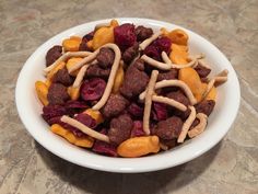 a white bowl filled with fruit and cereal