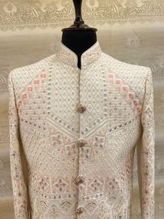 Chikakari sherwani of 100% thread weaving for all kind of occasions  chikankari (Lucknowi ) work sherwani in peach colour Wedding sherwani for Groom and groom Men  Indian plain brocade  sherwani designer party wear men's ethnic suit   Care instruction: dry clean  Top color:  fabric: silk base + cotton (thread weaving)  Package include:  Style- ethnic wear Top- sherwani jacket Bottom- churidar pants included Material- silk base  Product size guidance: please refer to chest size measurement in the size chart for your correct size  Slightly colour variation may be there due to camera resolution Designer Nehru Jacket With Chikankari Embroidery, Designer Long Sleeve Sherwani With Chikankari Embroidery, Designer Sherwani With Chikankari Embroidery And Long Sleeves, Designer Traditional Wear With Chikankari Embroidery, Semi-stitched Chikankari Sherwani In Jamawar, Semi-stitched Jamawar Sherwani With Chikankari Embroidery, Designer Sherwani With Chikankari Embroidery, Designer Nehru Jacket With Chikankari Embroidery For Ceremonial Occasions, Designer Cream Traditional Wear With Chikankari Embroidery