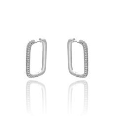 Hoop it up! Designed for everyday, these CZ Diamond Pave large rectangle hoops are a staple for your jewelry box. They shimmer with a high polish finish and feel light as a feather. So comfy and chic, you'll never want to take them off. More Details:- Carefully Handmade- 100% Hypoallergenic- Stainless Steel- Thickness: 3 mm- Hoops Size: 30 mm x 20 mm- Metal Color: Silver, 14k Gold Large Hoop Earrings, Cz Diamond, Tassel Earrings, Silver Hoop Earrings, Paper Clip, Pave Diamonds, Clip On Earrings, Silver Gold, Jewelry Box