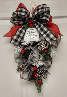 a christmas wreath hanging on the front door