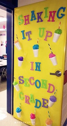 a classroom door decorated with ice cream and cupcakes that say shaking it up in second grade