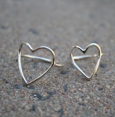 I'd been craving some light & delicate sterling rings for everyday wear, so I made this pretty heart ring along with a range of these ultra feminine & romantic rings. There are a few different styles like this in my shop - each equally dainty, pretty & eye catching! -d e s c r i p t i o n- I've used hand drawn (1.3mm thick) sterling wire to create these rings from scratch. Each shape is hand forged, so will be completely unique. The ring has been finished in a shiny mirror finish. Mo Delicate Sterling Silver Heart Ring, Simple Open Heart Silver Jewelry, Minimalist Heart-shaped Sterling Silver Midi Rings, Simple Silver Open Heart Jewelry, Sterling Silver Heart Midi Rings In Minimalist Style, Minimalist Sterling Silver Midi Rings For Valentine's Day, Valentine's Day Minimalist Sterling Silver Midi Rings, Dainty Open Heart Stackable Rings As Gift, Dainty Silver Open Heart Ring