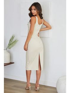 Elevate your evening with this timeless cocktail midi dress made up of nice PU leather fabric. * PU leather fabric. * Midi below the knee length. * Solid color. * Back middle slit. * Back zipper closure. 65% Polyurethane, 30% rayon, 5% polyester. Made in Italy. Cocktail Midi Dress, Midi Cocktail Dress, Good Stretches, Leather Fabric, Dress Making, The Knee, Knee Length, Pu Leather, Midi Dress