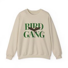 Go Birds This heavy blend crewneck sweatshirt is a must for this season. Wear this sweatshirt to the next game, whether you're catching the game at the Linc, Xfinity Live, or at home, show your love for the underdogs of the game. Our comfortable sweatshirt featuring the loved chant is sure to start the crowd screaming. This sweatshirt makes a great gift for you, your family, a friend, your boss, a co-worker, and everyone!!  Ideal for any situation, a unisex heavy blend crewneck sweatshirt is pure comfort. These garments are made from polyester and cotton. This combination helps designs come out looking fresh and beautiful. The collar is ribbed knit, so it retains its shape even after washing. There are no itchy side seams on these sweaters.  🌟 Extremely soft, light-weight, & comfortable ? Crew Neck Sweatshirt With Letter Print, Crew Neck Sweater With Slogan For Streetwear, Crew Neck Slogan Sweater For Streetwear, Streetwear Crew Neck Sweatshirt, Band Merch Hoodie With Relaxed Fit And Crew Neck, Slogan Crew Sweater For Streetwear, Band Merch Crew Neck Sweatshirt For Winter, Band Merch Sweater With Letter Print And Relaxed Fit, Band Merch Crew Sweatshirt With Letter Print