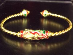 This is a perfect and unique style bracelet talisman made of magic brass and gold plated and longya red and green from Jula temple, the power of the bracelet is to protect all dangers and ghost and brings good luck, charm to the wearer, The bracelet showcases an elegant design with rare amulet style. It is great to get this pendant for your loved one or treat yourself for a classic timeless style.  Amulet Name: Red and Green Longya Tao Vetsuwan Bracelet Metal Type: Brass and Gold Plated, Stainless Stone Type: - Weight: 35.76 Gram (Approx.),  This item is only one left. Amulet Story:  "One of the kings of Chatulok Create wealth Multifarious with power"  You will help to have no shortage of finances. It also enhances the auspiciousness of power and prestige to be fearsome. Suppress bad luck Good Luck Brass Amulet Jewelry, Tibetan Jewelry Gold, Green Hand-strung Amulet Jewelry, Luxury Gold-tone Amulet Jewelry, Green Amulet-style Jewelry With Large Pendant, Pure Energy, Timeless Classic Style, Metal Bracelets, Tao