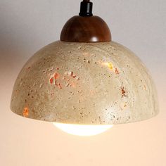 a white and brown light hanging from a ceiling