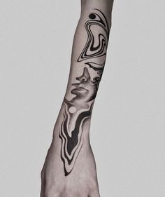 a person's hand with a tattoo on it and an abstract design in the middle