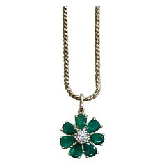 Emerald and Solitaire Diamonds Flower Pendant Necklace 14 Karat Yellow Gold Chain App0roximately 5 Carat Round Cut Emerald and 0.40 ct solitaire diamond flower pendant This exquisite Pendant is beautifully crafted with 14 karat Yellow gold 14 K gold with chain is 11.1 gm Length of the chain 16 inch Flower 18.5 MM round Fine 7 Pear Cut Emeralds with no color Enhancement are making a circle around a solitaire 40 pointer round brilliant diamond Unique flower shape Pendant Diamonds Total weight 0.40 Luxury Diamond Necklace With May Birthstone, Diamond Emerald Pendant Necklace, Diamond Pendant With Flower Charm, Elegant May Birthstone Necklace In Flower Shape, Elegant May Birthstone Necklace With Flower Shape, Elegant Flower Shaped Necklace With May Birthstone, Elegant Flower-shaped Necklace With May Birthstone, Elegant Flower-shaped May Birthstone Necklace, Emerald Diamond Pendant Necklace