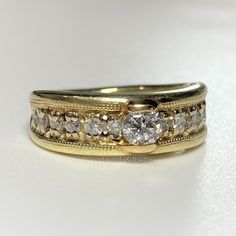 two gold wedding bands with diamonds on them