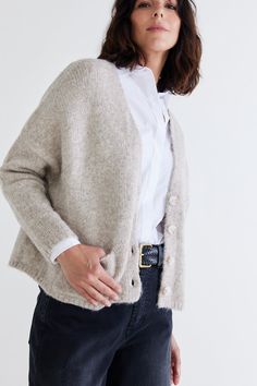 Indulge in the luxury of our High Standards Knit Cardigan, a harmonious blend of comfort, style, and craftsmanship that transcends ordinary fashion. The perfect layering piece for cozy days. Loose fit Buttons up Oversized sleeve Side pockets Oversized Tunic, Classic Blazer, Cargo Skirt, High Standards, Wide Leg Denim, Charcoal Color, Cozy Fall, Fashion Help, Comfort Style