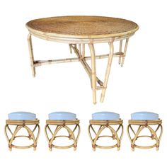 four stools and a table made out of bamboo