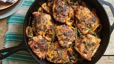 some meat and vegetables cooking in a pan