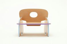 a wooden chair with a purple and blue seat on the bottom, sitting in front of a white background