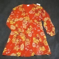 Floral Orange With Yellow And Tan Flowers, Baby Doll Style Dress, Chiffon With Lining, Long Sleeves, Elastic Wrist, Size L 12-14, Nwt. Polyester, Does Not Stretch. 36in Top To Bottom 22in Pit To Pit Party, Flow, Spring, Winter, Casual, Dressy, Work, Holiday, Delicate, Elegant, Date Night, Girls Night Out, Classy Yellow V-neck Chiffon Dress For The Beach, Yellow V-neck Chiffon Dress For Beach, Yellow V-neck Chiffon Beach Dress, Flowy Yellow Chiffon Dress With Floral Print, Yellow Floral Print Chiffon Dress For Spring, Yellow Chiffon Long Sleeve Dress, Orange Chiffon Long Sleeve Dress, Long Sleeve Peasant Dress, Long Sleeve Flowy Dress