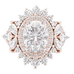 an oval cut diamond surrounded by round and pear shaped diamonds in a rose gold ring