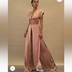 Cut From Lustrous Satin, The Hami Pants Are Overlaid With Draped Skirt Panels That Flow From The High-Rise Waistline To Full, Flared Hems. Style With The Matching Hami Crop Top In Pearl Pink Both Pieces Are Size Xs. Selling As A Set Pearl Pink Color, Andrea Iyamah, Flowy Crop Top, Drape Pants, Pearl Pink, Draped Skirt, High Waist Pants, Waist Pants, High Waisted Pants