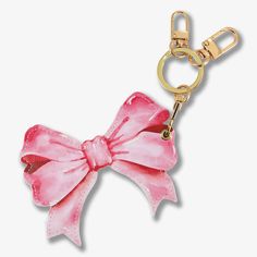 a pink bow keychain on a white background