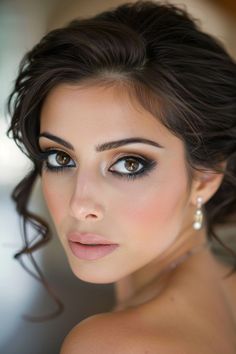 Wedding makeup can highlight the warmth and depth of brown eyes, making them even more striking. See more ideas here.