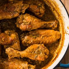 some chicken wings are cooking in a pot